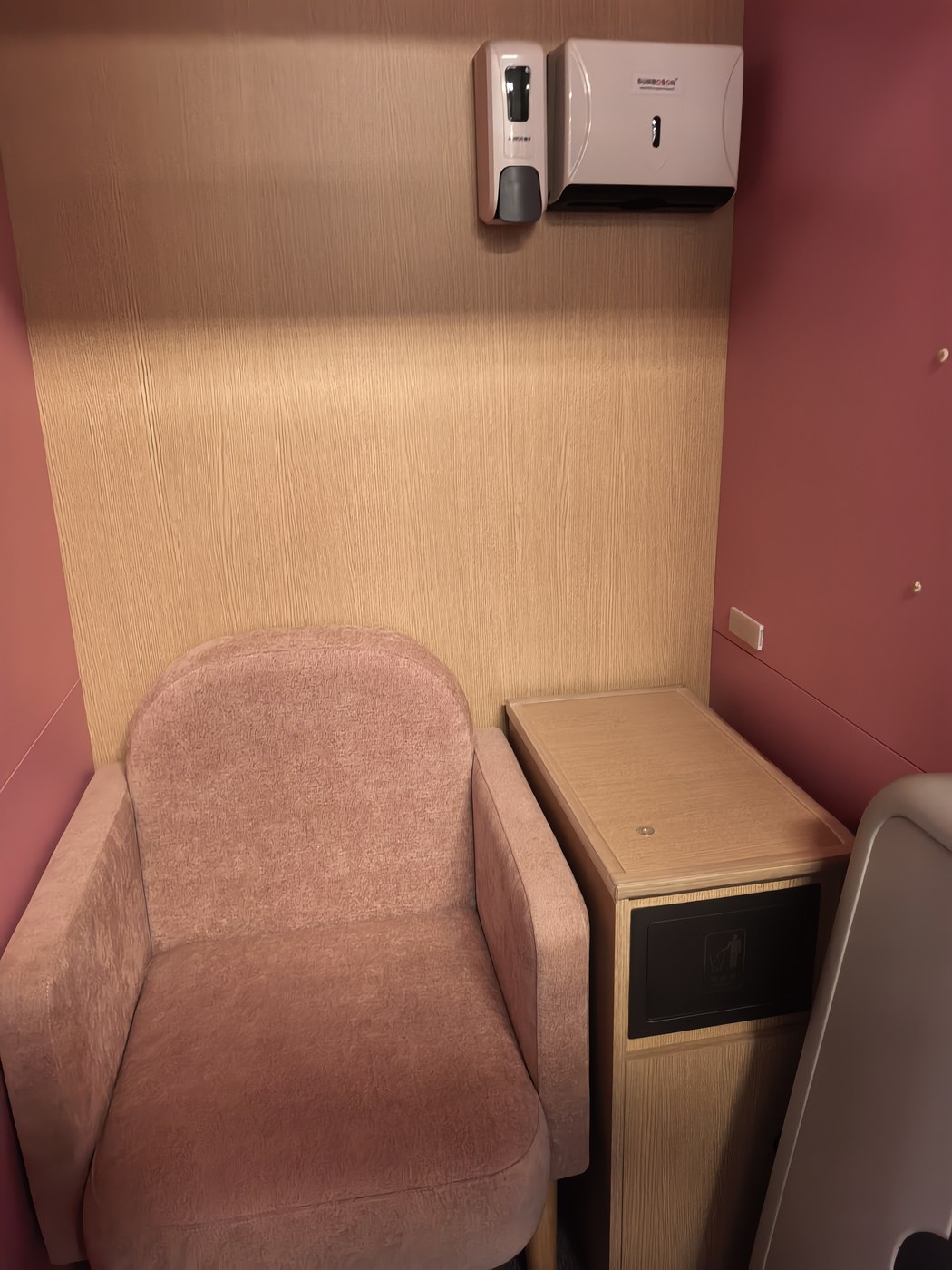 Interior nursing armchair and storage side cabinet with integrated waste bin